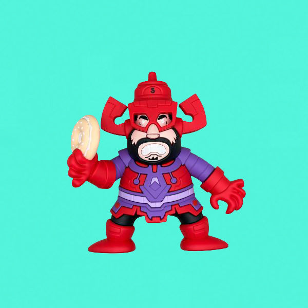 Toy figure in red and purple costume holding a cookie against a teal background